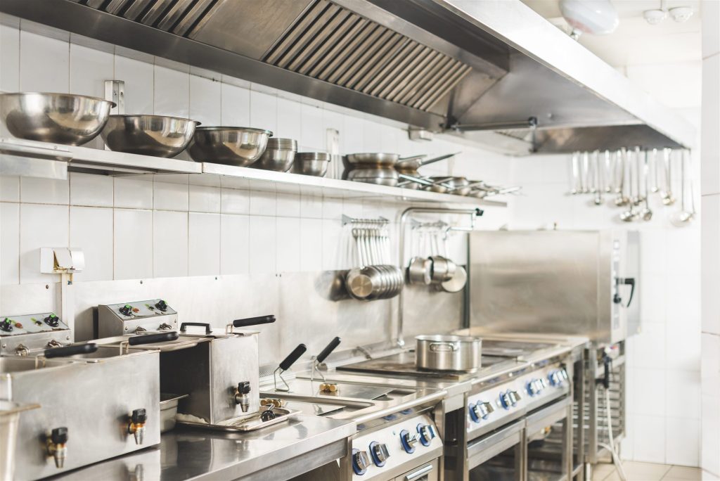 Commercial kitchen with stainless steel counters and equipment