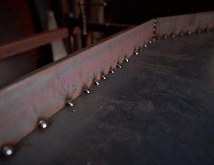 Close-up of a weld joining two steel plates