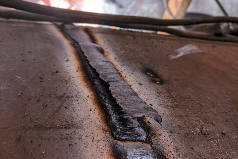 Weld joining two metal pieces with visible bead texture